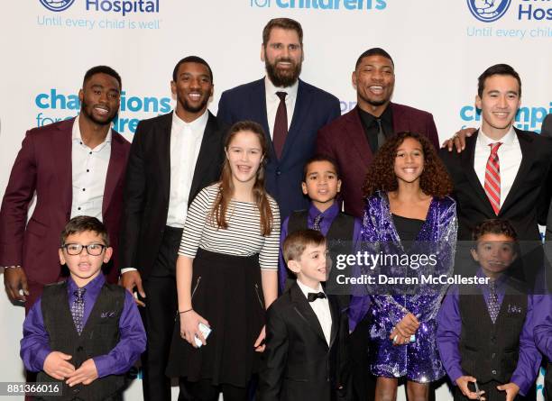 Brandin Cooks, Malcolm Mitchell, Sebastian Vollmer, Marcus Smart, and Justin Doo with the kids at Champions for Children's benefitting Boston...