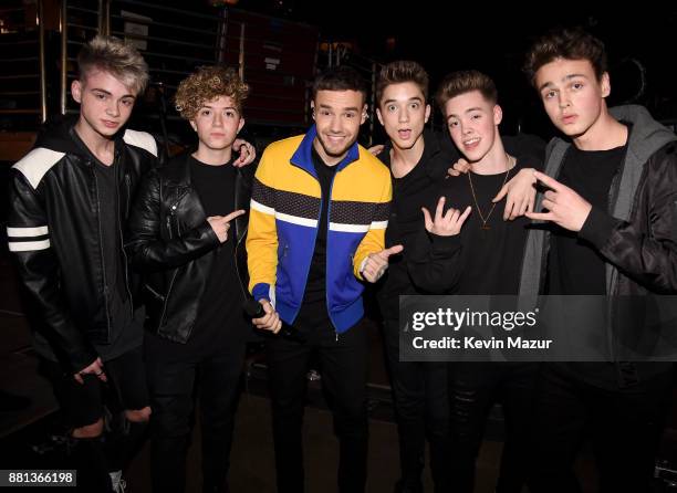Liam Payne and members of music group Why Don't We Corbyn Besson, Jack Avery, Daniel Seavey, Zach Herron, and Jonah Marais are seen backstage at...