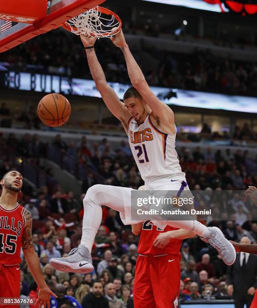 Alex Len of the Phoenix Suns dunks against the Chicago Bulls at the United Center on November 28, 2017 in Chicago, Illinois. The Suns defeated the...