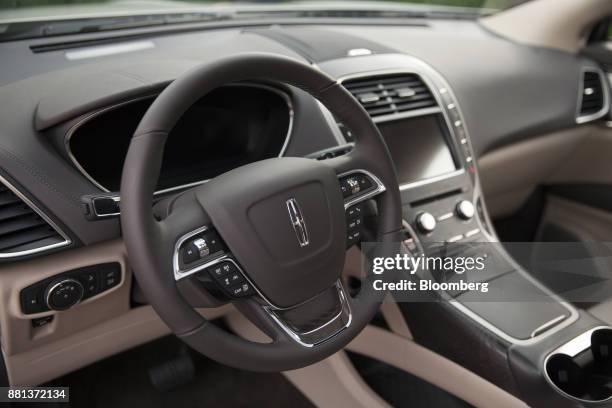 The interior of a Ford Motor Co. Lincoln Nautilus sport utility vehicle is seen during an event in Los Angeles, California, U.S., on Monday, Nov. 27,...