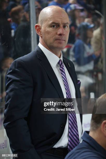 Assistant coach Darryl Williams of the New York Rangers sports a lavender Tie in honor of Hockey Fights Cancer Awareness Night at Madison Square...