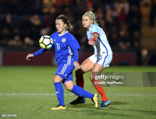 Saule Karibayeva of Kazakhstan Women's and England Women's Steph Houghton during 2019 FIFA Women's World Cup Qualifier match between England Women...
