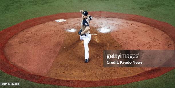 Shohei Otani of the Nippon Ham Fighters pitches for his 15th win in the 2015 season during a game against the Orix Buffaloes at Kyocera Dome in Osaka...
