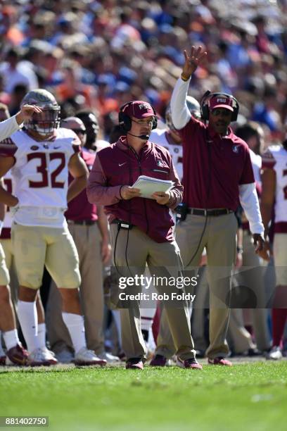 Head coach Jimbo Fisher of the Florida State Seminoles looks on during the game against the Florida Gators at Ben Hill Griffin Stadium on November...