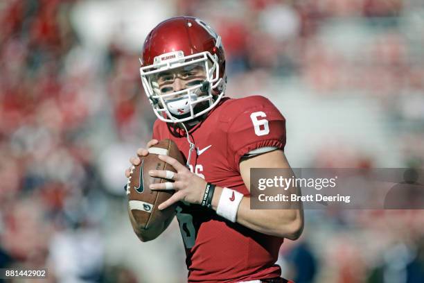 Quarterback Baker Mayfield of the Oklahoma Sooners warms up before the game against the West Virginia Mountaineers at Gaylord Family Oklahoma...