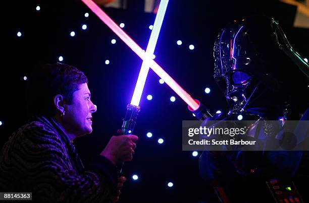Lynne Kosky , Victoria's Minister for Public Transport and Minister for the Arts has a lightsaber battle with an actor dressed as Darth Vader during...