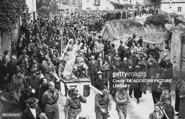 Veterans of the Ethiopian War taking into procession a statue of Our Lady of the Guard, October 18 Genoa, Italy, 20th century.