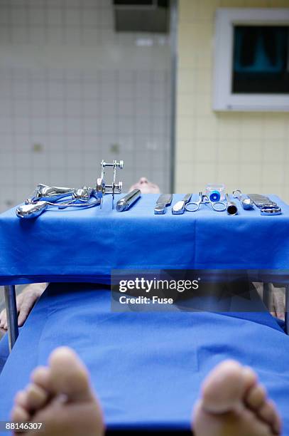 body of dead person in morgue - autopsie stock-fotos und bilder