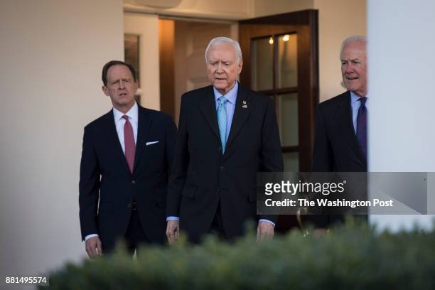 Senate Finance Committee Chairman Sen. Orrin Hatch, R-Utah, and members Sen. John Cornyn, R-Texas and Sen. Patrick Toomey, R-Pa., left, walk from the...