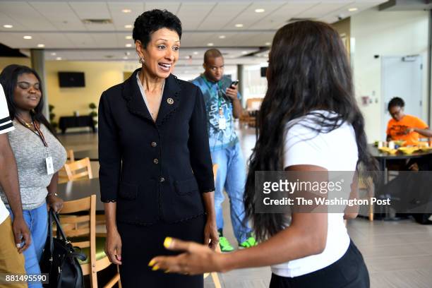 New president of Bowie State University Aminta Hawkins Breaux chats with senior Daionna Young at the student center on campus July 20, 2017 in Bowie,...