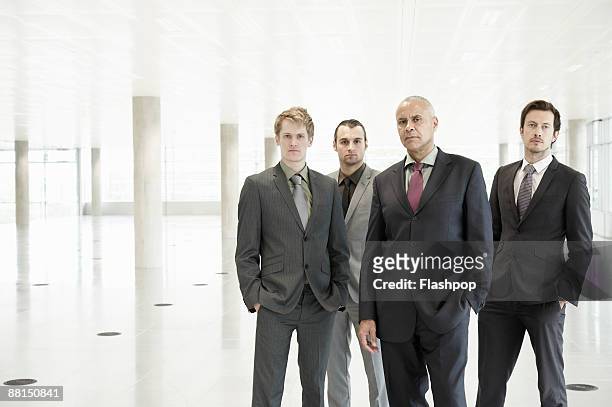 group portrait of business men - four people stock-fotos und bilder