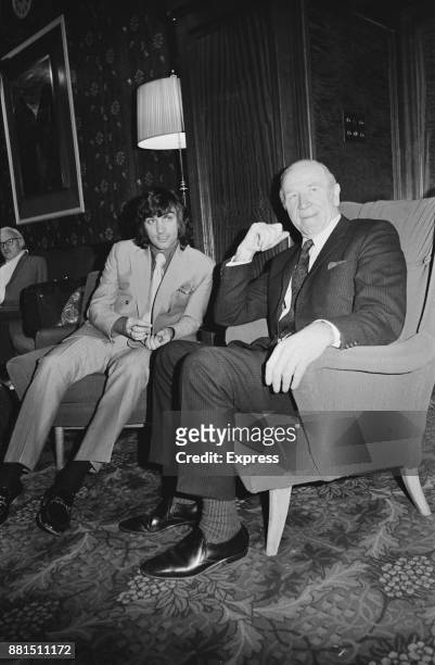 Northern Irish football player George Best of Manchester United FC with manager Matt Busby at the FA's headquarters for a disciplinary hearing...