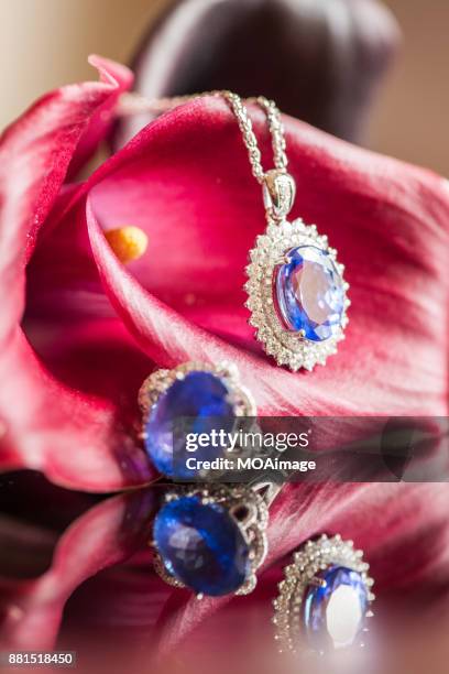 sapphire diamond ring、neckless and flower - saphire stock pictures, royalty-free photos & images
