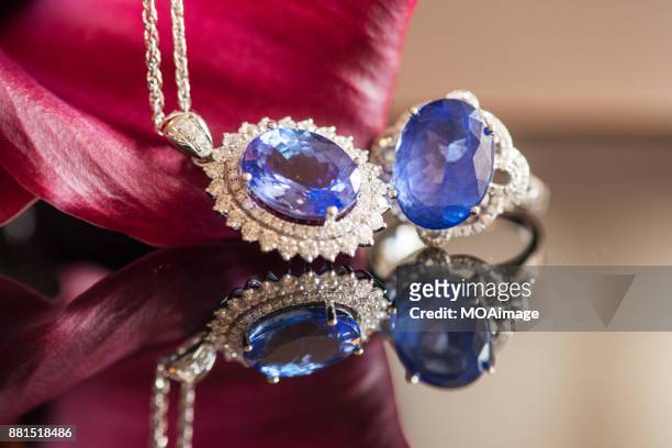 sapphire diamond ring、neckless and flower - saphire stock pictures, royalty-free photos & images