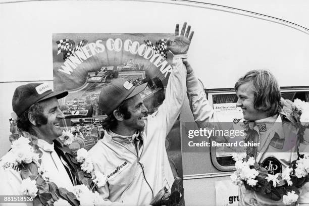 Peter Revson, Denny Hulme, Ronnie Peterson, Grand Prix of Great Britain, Silverstone Circuit, 14 July 1973. Peter Revson celebrating his victory in...