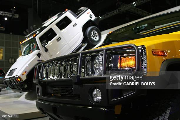 Hummer H3 units are presented at the 100th Annual Los Angeles Auto Show, in this November 30, 2006 file photo. General Motors announced June 2, 2009...