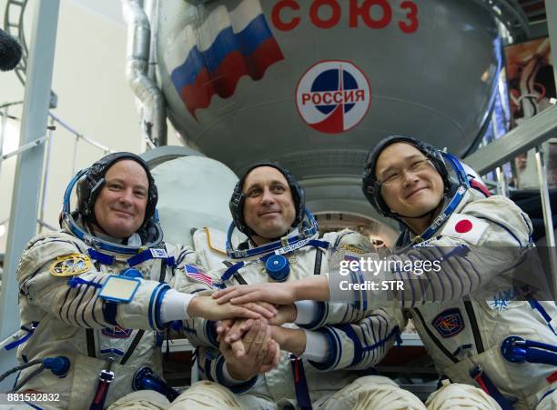 Members of the International Space Station expedition 54/55, NASA astronaut Scott Tingle , Roscosmos cosmonaut Anton Shkaplerov and Norishige Kanai...