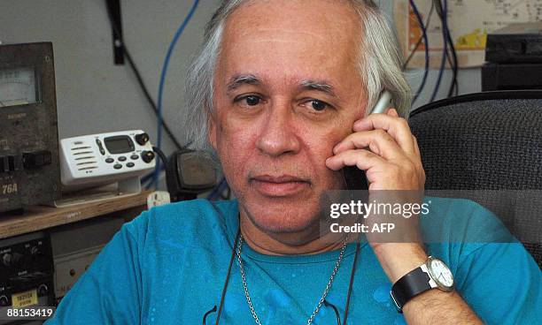 Brazilian radio ham Andre Sampaio, based in Fernando de Noronha island, talks on a mobile phone on June 2, 2009. Sampaio got and recorded a...