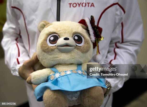 Toyota Motor Corp.'s Pocobee partner robot is held for a demonstration during the International Robot Exhibition 2017 at the Tokyo Big Sight on...