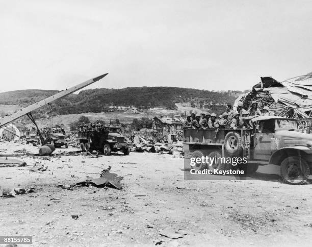 American Marines of the 2nd Division are transported away from the battlefield at the Tanapag seaplane base after the Battle of Saipan in the...