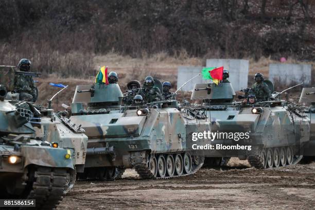 South Korean soldiers ride in tanks during a military exercise near the border in Paju, South Korea, on Wednesday, Nov. 29, 2017. South Korea's...