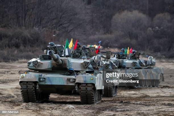 South Korean soldiers ride in tanks during a military exercise near the border in Paju, South Korea, on Wednesday, Nov. 29, 2017. South Korea's...