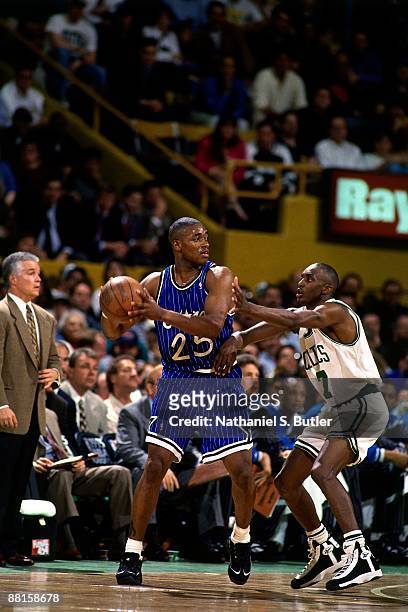 Nick Anderson of the Orlando Magic looks to pass against Dee Brown of the Boston Celtics in Game Three of the Eastern Conference Quarterfinals during...