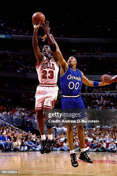Michael Jordan of the Chicago Bulls shoots a jump shot against Anthony Avent of the Orlando Magic in Game Three of the Eastern Conference Semifinals...