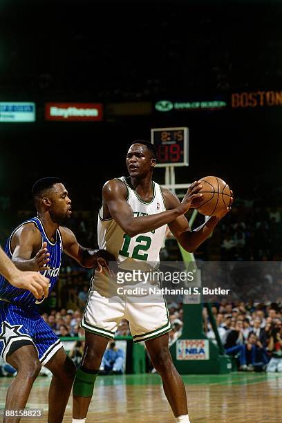 Dominique Wilkins of the Boston Celtics looks to pass against Donald Royal of the Orlando Magic in Game Three of the Eastern Conference Quarterfinals...