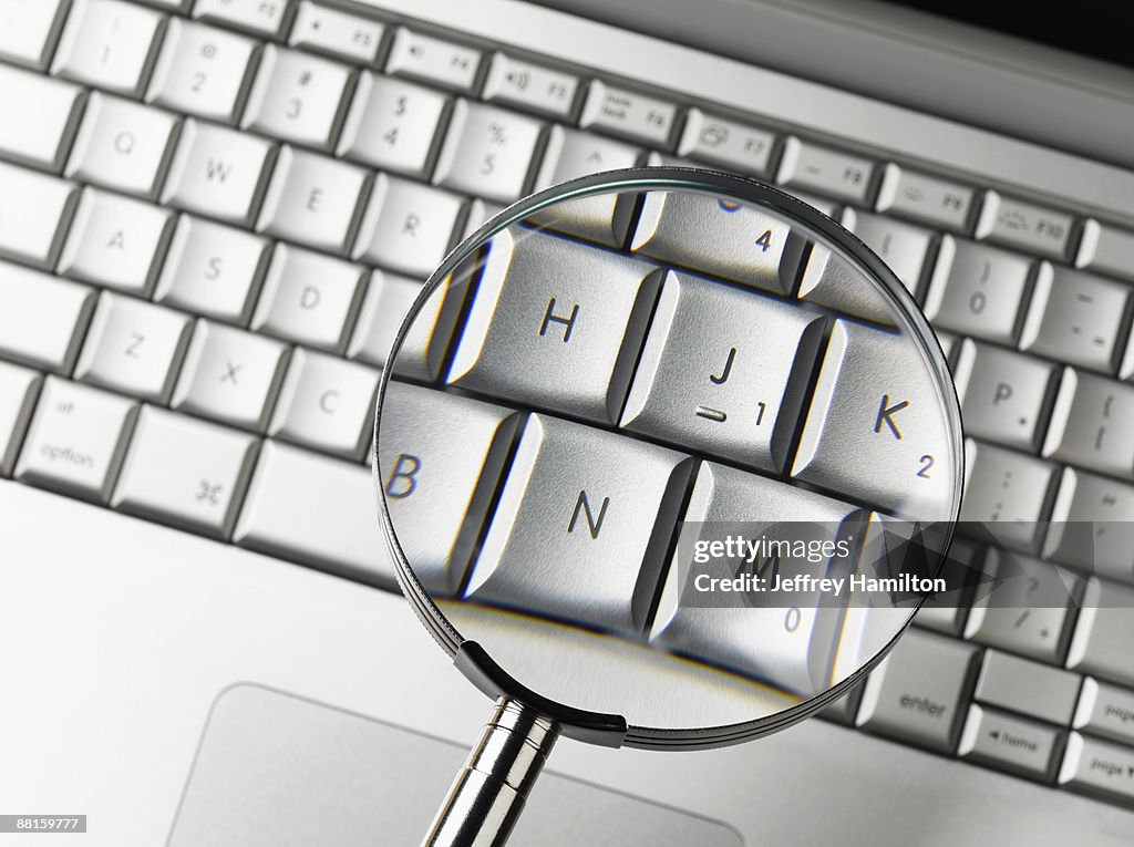 Computer Keyboard Magnifying Screen Magnifying Glass Over Laptop Keyboard High-Res Stock Photo - Getty Images