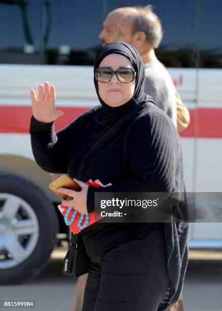 Egyptian actress Dalal Abdel-Aziz gestures as she attends the funeral of the late popular singer and actress Shadia, at the Sayeda Nafisa mosque in...