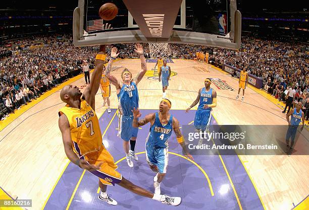 Lamar Odom of the Los Angeles Lakers lays up a shot against Chris Andersen and Kenyon Martin of the Denver Nuggets in Game Five of the Western...