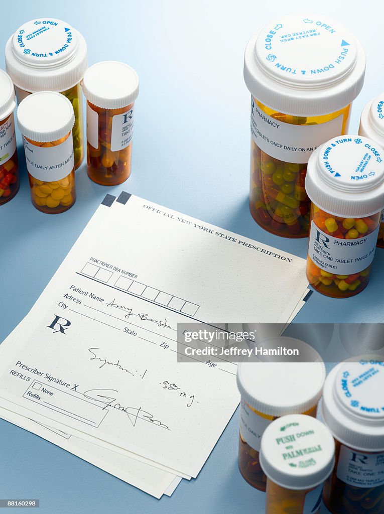 Prescription slip and pill bottles