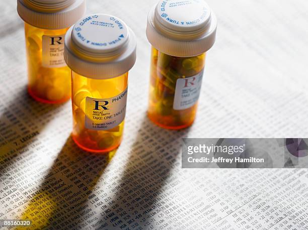 pill bottles on stock page - prescription medicine stock pictures, royalty-free photos & images