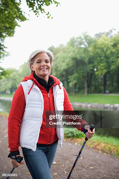 a woman pole walking sweden. - europeo del norte fotografías e imágenes de stock