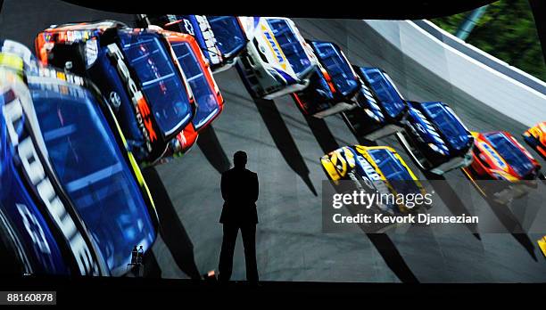 Jack Tretton, President and CEO Sony Computer Entertainment America, looks at the display of new video game Gran Turismo 5 during Sony's Electronics...