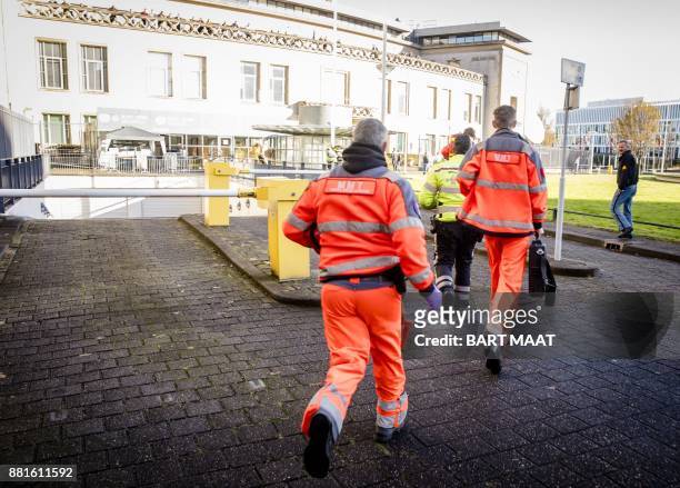Emergency Services staff run near the International Criminal Tribunal for the former Yugoslavia in The Hague, on November 29, 2017. The United...