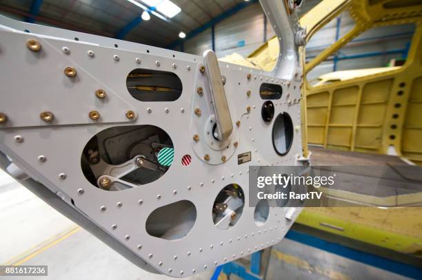 an airplane fuselage and door being assembled. - fuselage fotografías e imágenes de stock