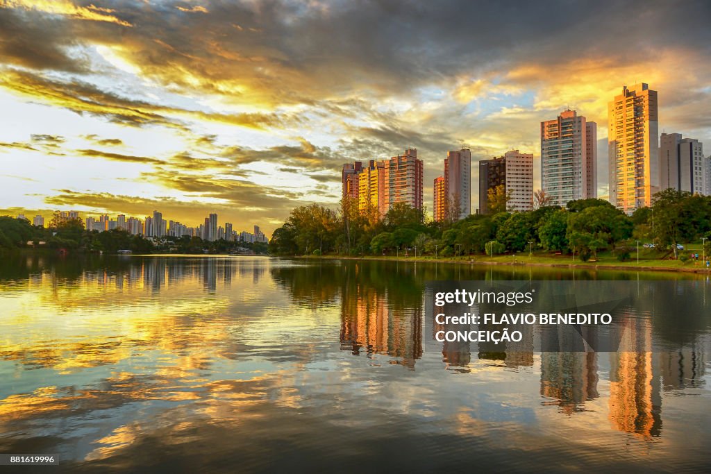 Buildings of apartments on the banks of Lake Igapo with the sunset and red clouds