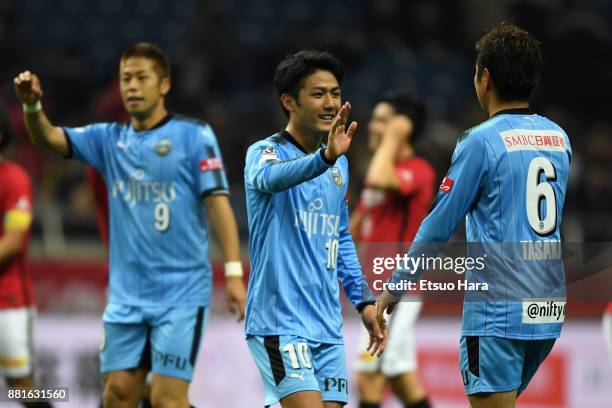 Takayuki Morimoto, Ryota Oshima and Yusuke Tasaka of Kawasaki Frontale celebrate their 1-0 victoory in the J.League J1 match between Urawa Red...