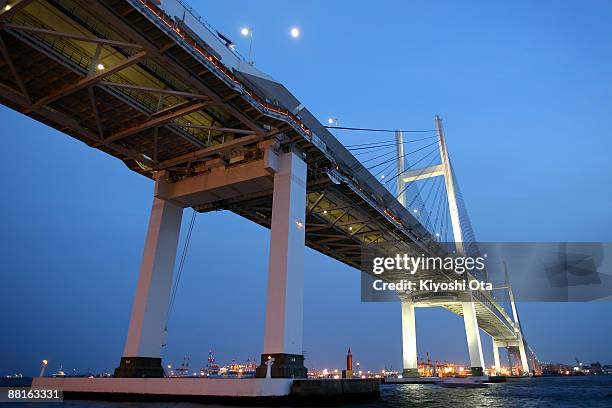 Yokohama Bay Bridge is seen over Tokyo Bay on June 2, 2009 in Yokohama, Japan. Yokohama, located a short distance from Tokyo, attracts many visitors...