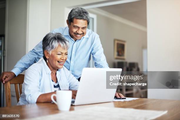 that's better than expected! - senior adult on computer stock pictures, royalty-free photos & images