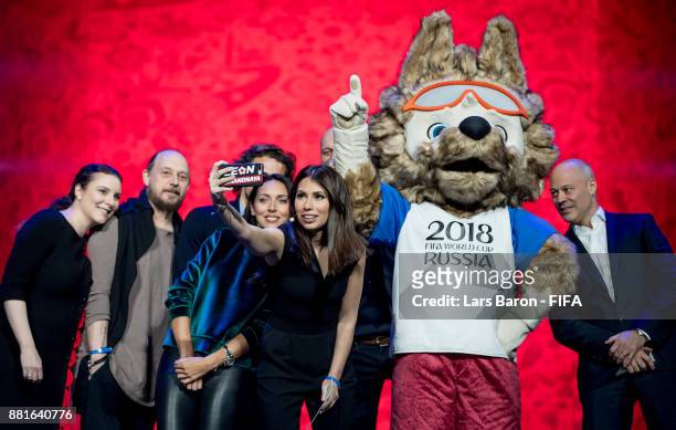 Natella Nikolau, Felix Mikhailov, Diego Forlan, Alsou, Maria Komandnay, Chris Unger and Paul Redman take a selfie with the 2018 World Cup mascot...