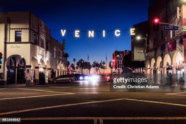 iconic venice sign in venice beach at dusk - venice beach stock pictures, royalty-free photos & images