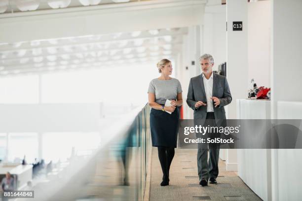 moving meeting - real people serious not looking at camera not skiny stock pictures, royalty-free photos & images