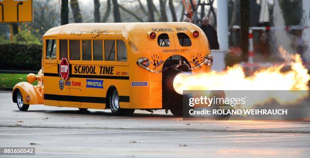 Car designer Gerd Habermann launches his "School Bus Jet" vehicle during a preview of the Essen Motor Show on November 29, 2017 in Essen, western...