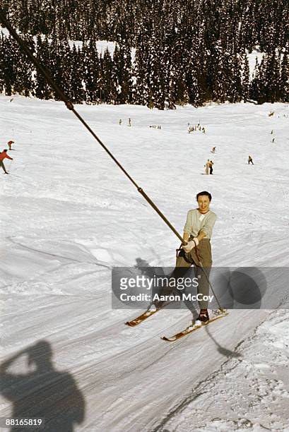 woman on a ski lift - tellerlift stock-fotos und bilder