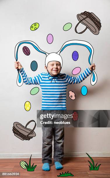 boy in a rabbit costume, pulls his ears - pulling ear stock pictures, royalty-free photos & images