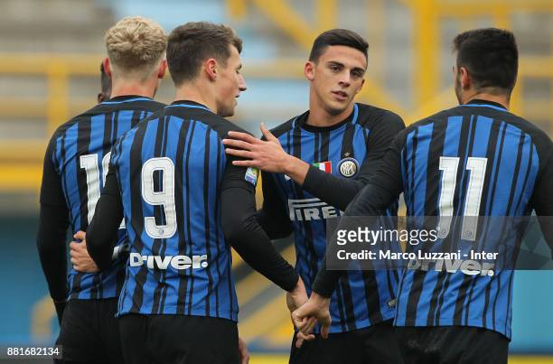 Andrea Pinamonti of FC Internazionale celebrates with his team-mates Gabriele Zappa and Matteo Rover after scoring the opening goal during the Serie...