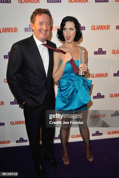 Piers Morgan and singer Katy Perry poses with the Aussie Hair Newcomer Award during the Glamour Women of the Year Awards 2009 at Berkeley Square...